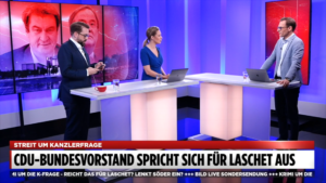 Allzeit bereit: Bild-Vize Ronzheimer hängt sogar während der Live-Übertragung am Smartphone. Foto: Screenshot Bild Live